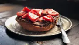 Bread topped with nutella and strawberries. Credit: Unsplash