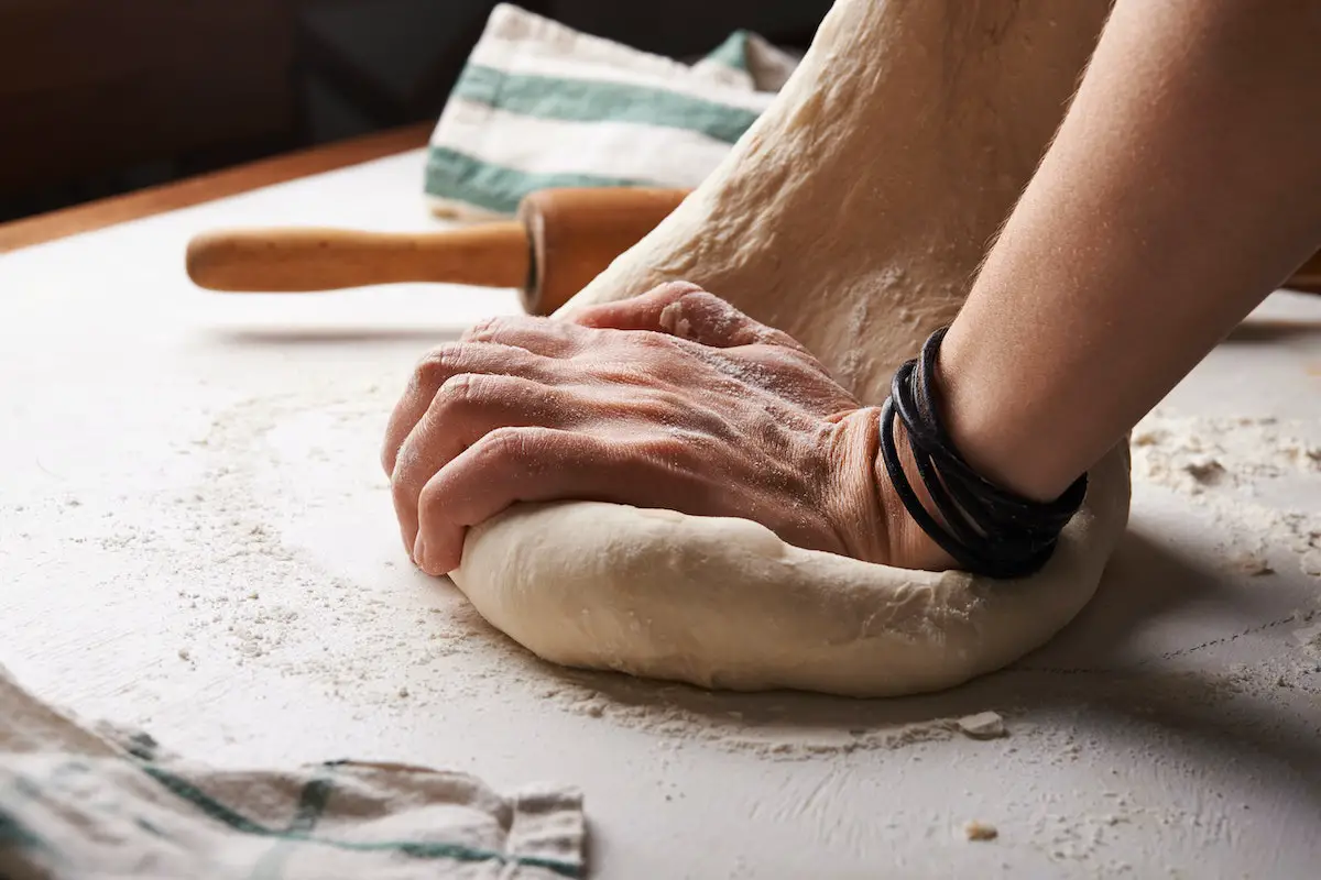 Kneading dough. Credit: Unsplash