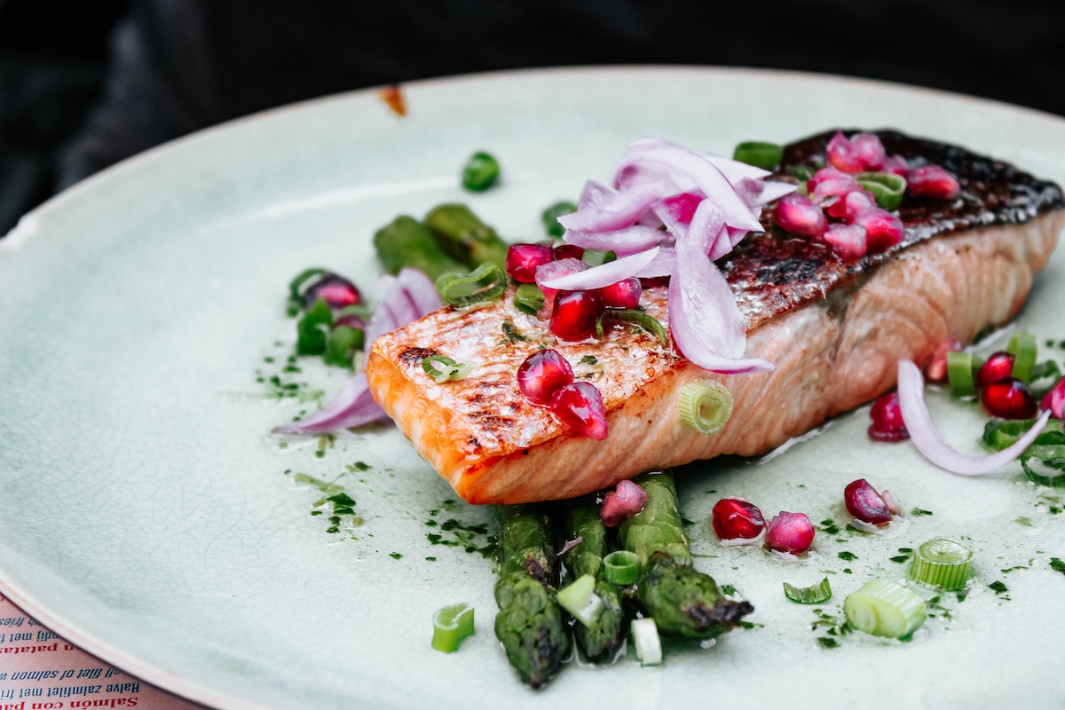 Beautiful - asparagus, red onion, pomegranate and salmon. Credit: Unsplash