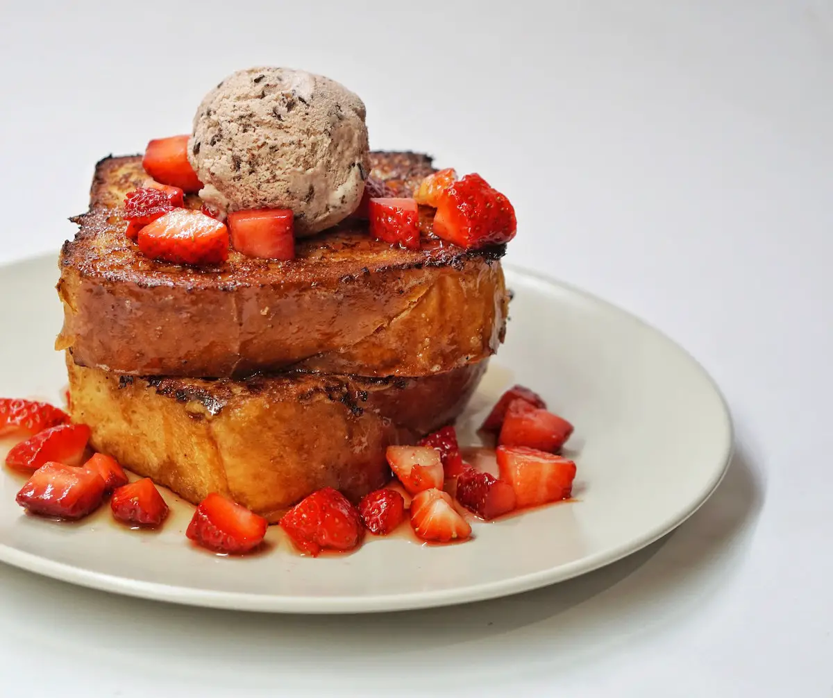 Stack of French toast with strawberries. Credit: Unsplash