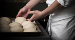 Defrosting pizza dough on a tray. Credit: Unsplash