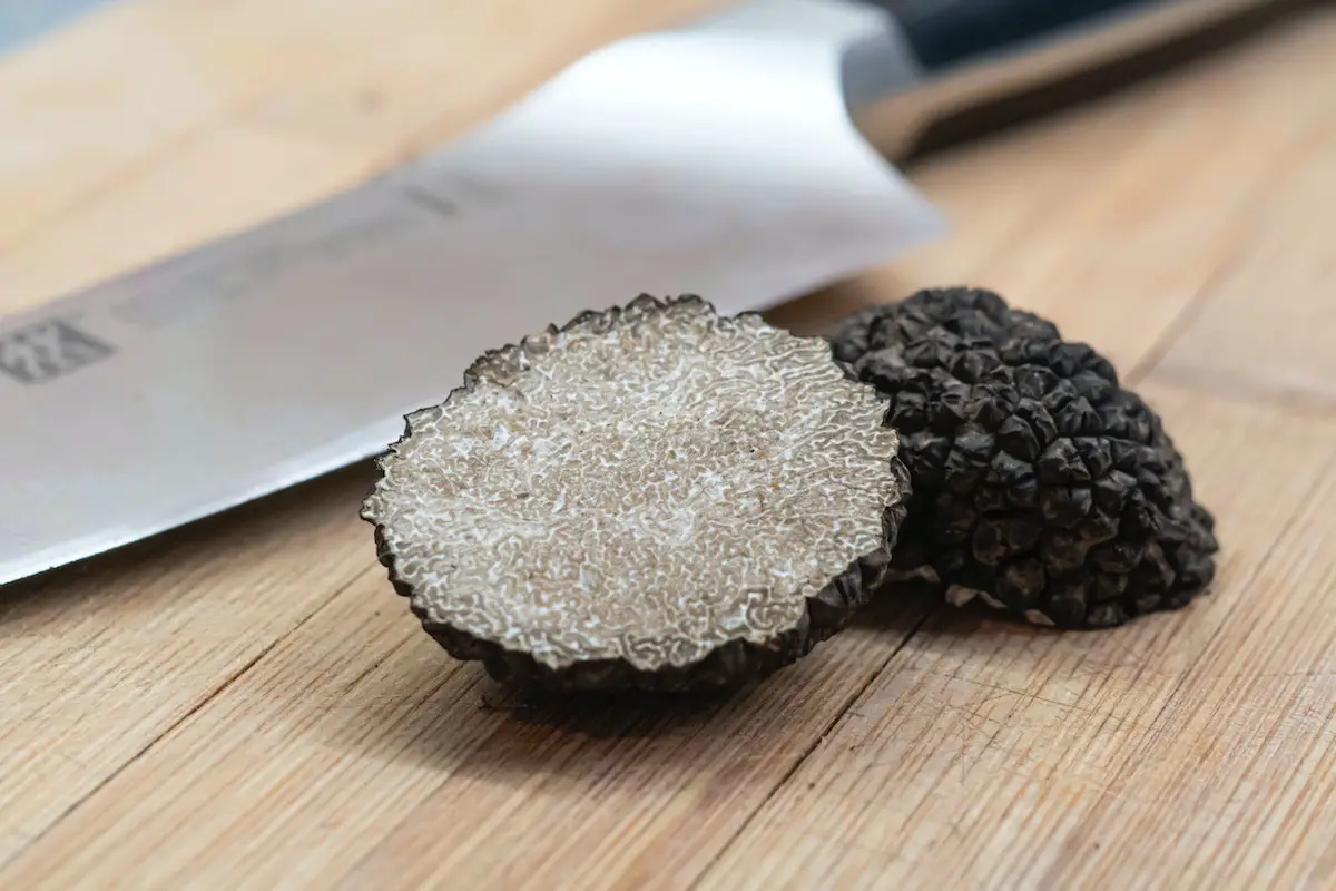 Black truffle cut in half. Credit: Unsplash