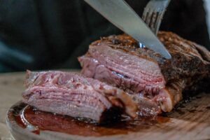 Cutting a roast beef. Credit: Unsplash