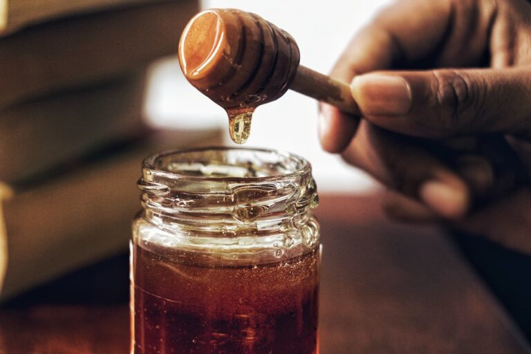 Honey being poured out of a jar. Credit: Unsplash