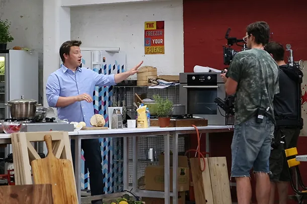 Jamie Oliver presenting on his cookshow.