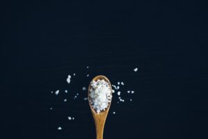 Salt on a wooden spoon. Credit: Unsplash