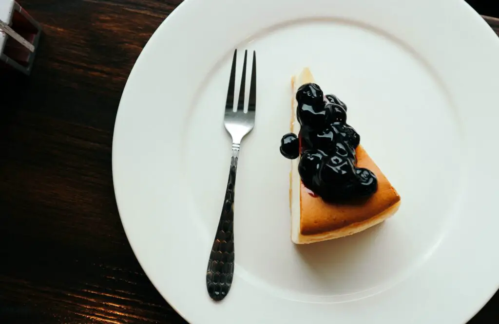 Baked cheesecake with blueberry ganache on top.