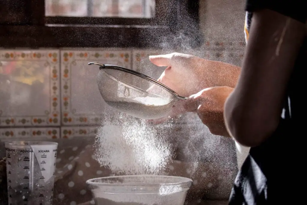 Using a sieve to make the flour extra fine.