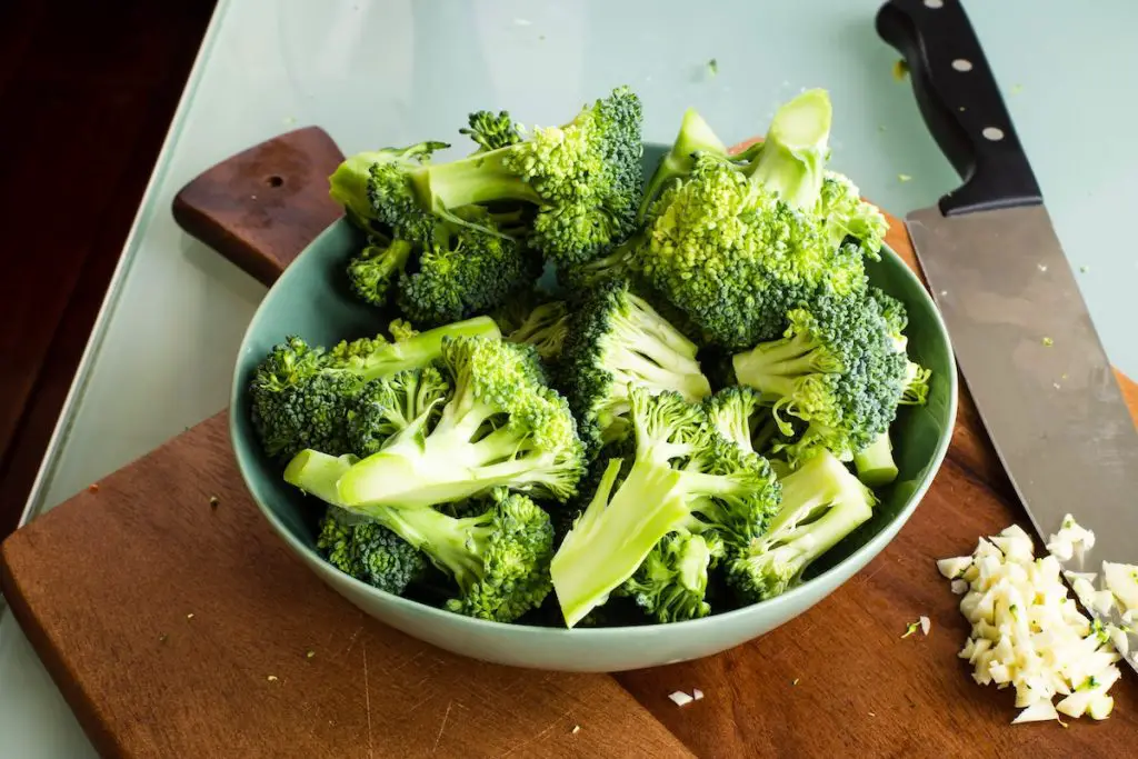 Broccoli sliced in a bowl.