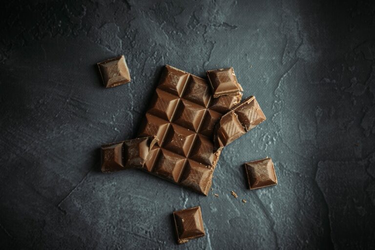 Chocolate broken up on a granite surface.