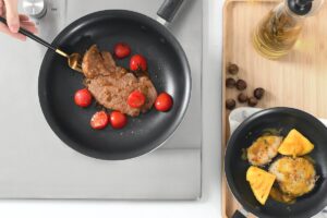 Cooking with frying pans. Credit: Unsplash
