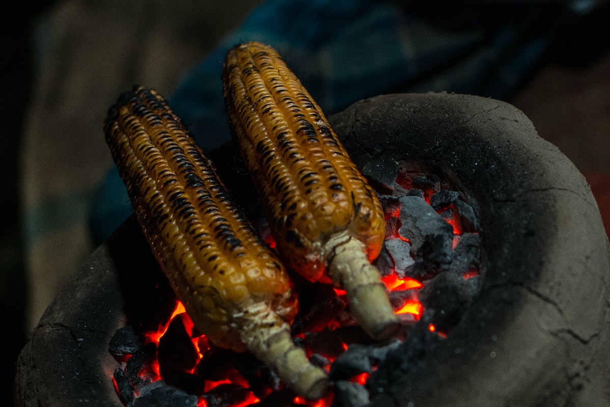 Corn blackened over bbq. Credit: Unsplash