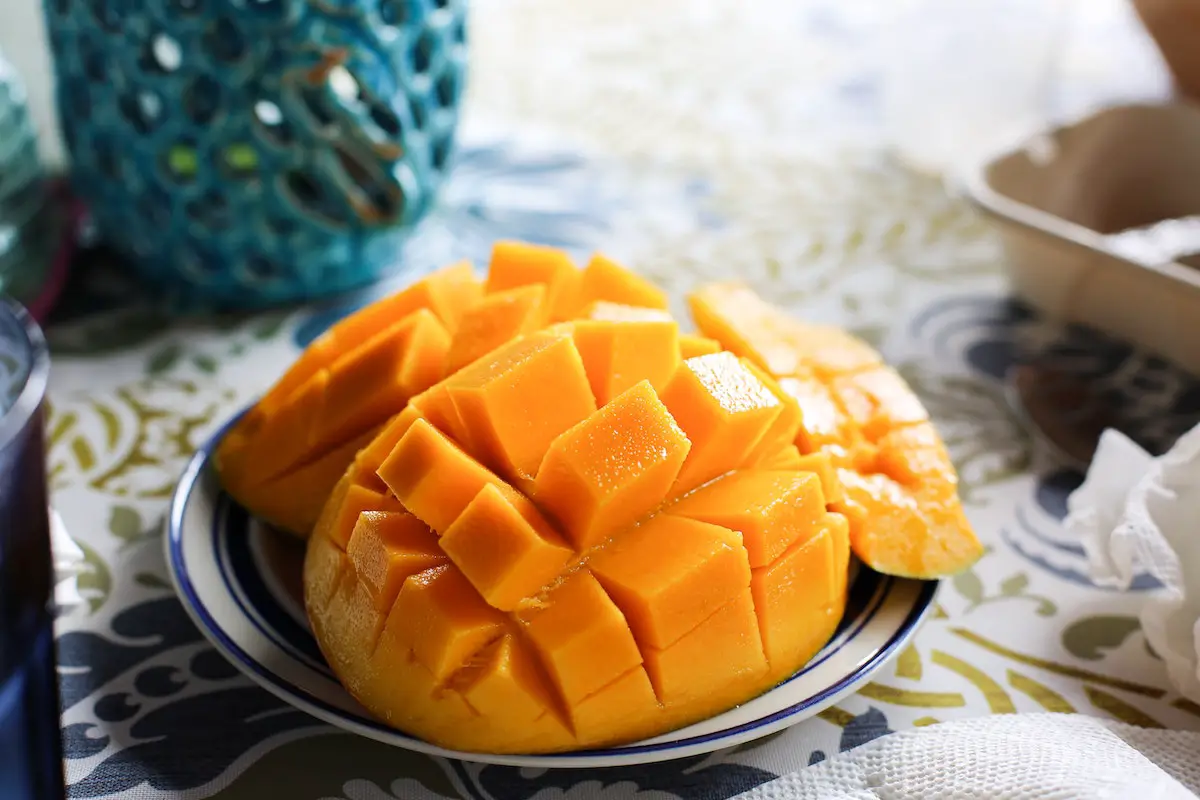 Mango sliced on a plate. Credit: Unsplash