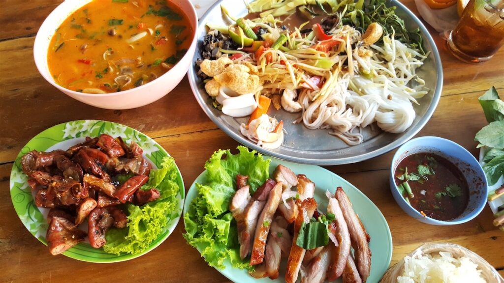 Different Thai dishes on a table.