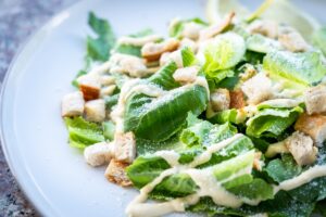 Chicken Ceasar salad on a plate. Credit: Unsplash