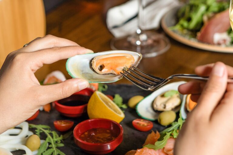 Eating mussels with a fork. Credit: Farhad Ibrahimzade
