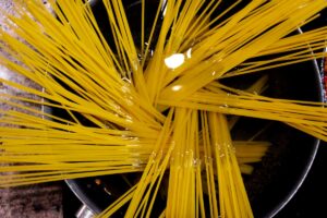 Boiling pasta in a pan.
