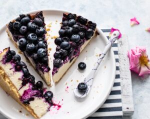Cheesecake with blueberries on top.