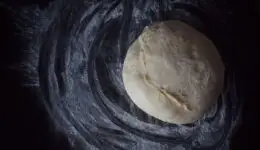 Pizza dough left on the counter.
