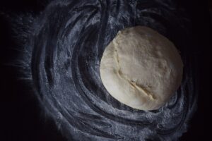Pizza dough left on the counter.