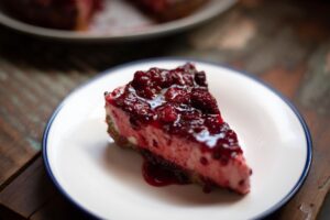 Portion of raspberry cheesecake.