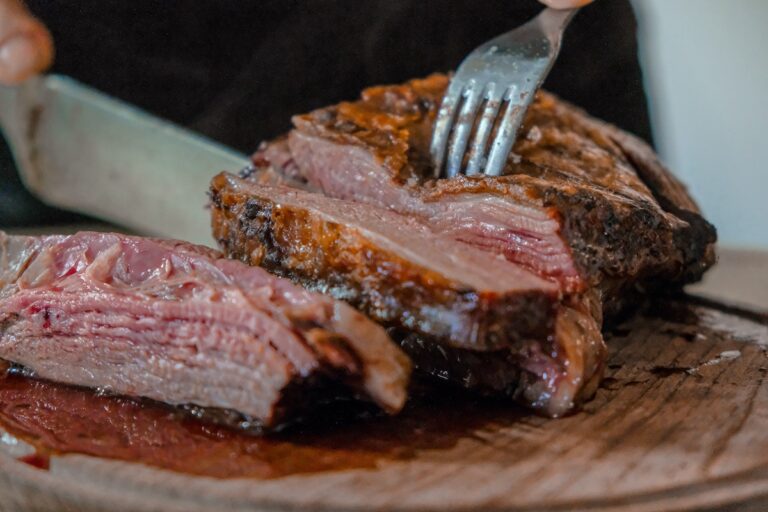 Slicing into steak. Credit: Unsplash