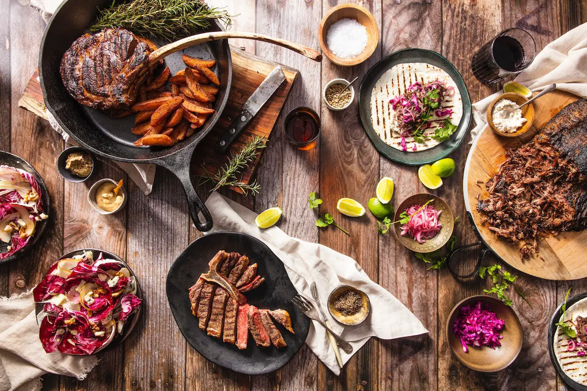 Steak dishes on a table. Credit: Unsplash