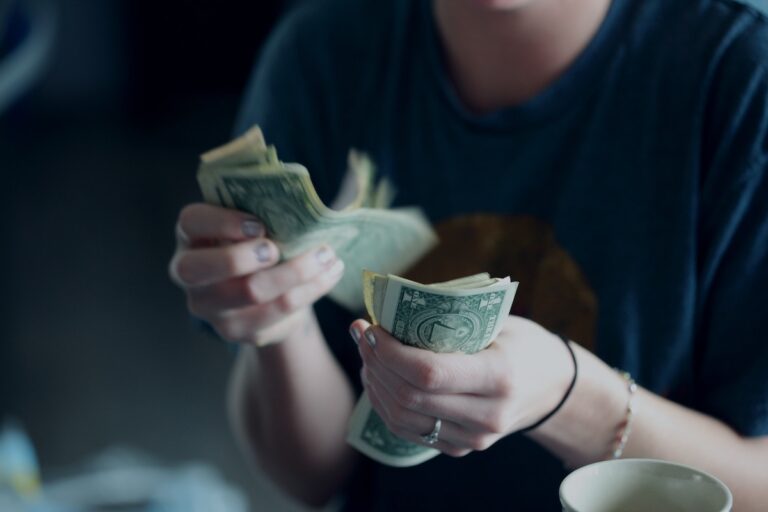 Counting cash dollars.