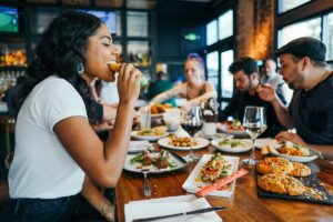 Diners eating at a restaurant table.
