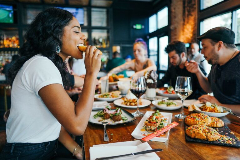 Diners eating at a restaurant table.