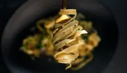 Pasta wrapped around a fork.