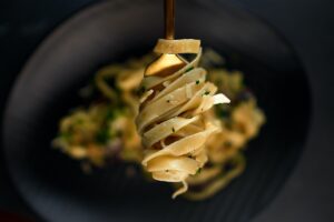 Pasta wrapped around a fork.