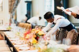 Waiter setting a table up.